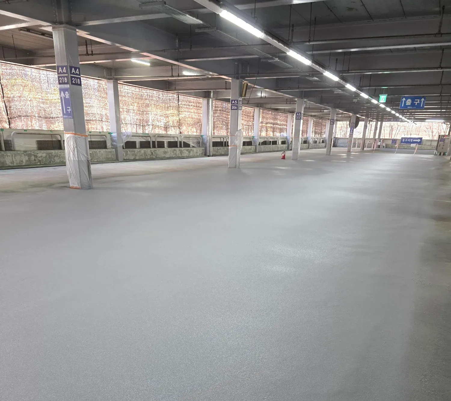 Completed spray polyurea coating surface in parking structure — APTECH PK-410 application result